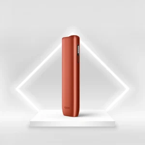 IQOS ILUMA i ONE Vivid Terracotta – front view of stylish tobacco heating device