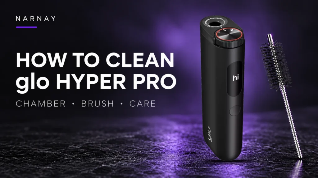 Black glo HYPER PRO device beside its cleaning brush on a dark background with purple lighting.